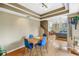 Open dining area with table and chairs flowing to a living space with natural light at 200 Cocoanut Ave # 1, Sarasota, FL 34236