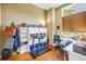 Functional home office space with a desk, treadmill, and ample storage solutions at 200 Cocoanut Ave # 1, Sarasota, FL 34236