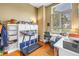 Bright home office with a workspace, treadmill, and storage, bathed in natural light at 200 Cocoanut Ave # 1, Sarasota, FL 34236