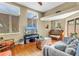 Cozy living room with hardwood floors, large windows, and comfortable seating at 200 Cocoanut Ave # 1, Sarasota, FL 34236
