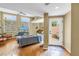 Living room with hardwood floors, comfortable seating, and access to a private outdoor courtyard at 200 Cocoanut Ave # 1, Sarasota, FL 34236