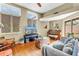 Bright living room with hardwood floors, comfortable seating, and natural light from large windows at 200 Cocoanut Ave # 1, Sarasota, FL 34236