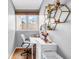 Bright office space featuring natural light, wood floors, and a contemporary desk setup with shelving at 200 Cocoanut Ave # 1, Sarasota, FL 34236