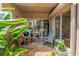 Cozy brick patio with outdoor seating, grill, and lush greenery, perfect for relaxation and entertaining guests at 200 Cocoanut Ave # 1, Sarasota, FL 34236