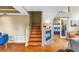 Staircase with wood steps and adjacent fireplace leading to bonus room at 200 Cocoanut Ave # 1, Sarasota, FL 34236