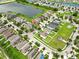 An aerial view of a neighborhood with a community lake and well-manicured lawns at 2118 Song Sparrow Ct, Ruskin, FL 33570