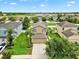 Aerial view of a home in a well maintained neighborhood with mature landscaping at 2118 Song Sparrow Ct, Ruskin, FL 33570