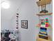 Playroom featuring a vaulted ceiling, built in shelving, and creative decor at 2118 Song Sparrow Ct, Ruskin, FL 33570