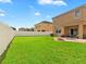 The expansive backyard, enclosed by a white fence, offers plenty of space for outdoor enjoyment at 2118 Song Sparrow Ct, Ruskin, FL 33570