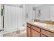 Bathroom with shower/tub combination and decorative vanity cabinet at 2118 Song Sparrow Ct, Ruskin, FL 33570