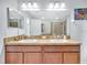 Bathroom features double sinks, spacious vanity, and large mirror at 2118 Song Sparrow Ct, Ruskin, FL 33570