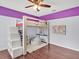 Bedroom with loft bed and purple accent wall is perfect for a  at 2118 Song Sparrow Ct, Ruskin, FL 33570