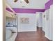 Bedroom with purple accent wall and a loft bed, perfect for a  at 2118 Song Sparrow Ct, Ruskin, FL 33570