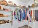 Walk-in closet with wire shelving and hanging rods for optimal storage at 2118 Song Sparrow Ct, Ruskin, FL 33570
