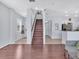 Spacious entryway with hardwood floors and a staircase leading to the upper level at 2118 Song Sparrow Ct, Ruskin, FL 33570