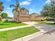 Two-story home with a well-manicured lawn and a two-car garage at 2118 Song Sparrow Ct, Ruskin, FL 33570