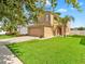 Beautiful two-story home with a well-maintained lawn, and neutral colored exterior at 2118 Song Sparrow Ct, Ruskin, FL 33570