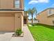 Charming home with palm tree in the front yard, beautiful lawn, and a welcoming entrance at 2118 Song Sparrow Ct, Ruskin, FL 33570