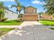Two-story home with a well-manicured lawn and a two-car garage at 2118 Song Sparrow Ct, Ruskin, FL 33570