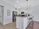 Bright kitchen with stainless steel appliances, granite countertops, pendant lights, and barstool seating at 2118 Song Sparrow Ct, Ruskin, FL 33570