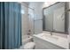 Clean bathroom with a shower and tub combination, vanity, and modern fixtures at 2400 Ezzell Ct, Sarasota, FL 34237