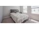 Cozy bedroom with carpet, large windows, and neutral decor for a relaxing space at 2400 Ezzell Ct, Sarasota, FL 34237