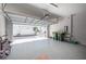 Spacious two-car garage with an open door, offering ample parking and easy access to the street at 2400 Ezzell Ct, Sarasota, FL 34237