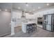 Bright, modern kitchen with a center island, stainless steel appliances, and ample cabinet space at 2400 Ezzell Ct, Sarasota, FL 34237