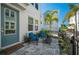 Charming patio with outdoor seating, a table, and well-maintained landscaping providing a relaxing outdoor space at 2400 Ezzell Ct, Sarasota, FL 34237
