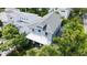 Aerial shot of home featuring a metal roof, manicured landscaping, and an inviting backyard at 2410 Prospect St, Sarasota, FL 34239