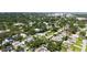 A high angle aerial view of a neighborhood, showcasing the property and surrounding homes at 2410 Prospect St, Sarasota, FL 34239