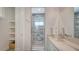 Bathroom with double sink vanity, modern fixtures, and a walk-in glass shower at 2410 Prospect St, Sarasota, FL 34239