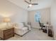 Cozy bedroom features a ceiling fan, window, and neutral carpet at 2410 Prospect St, Sarasota, FL 34239