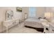 Bedroom features a full-length mirror, dressing table, and a bed at 2410 Prospect St, Sarasota, FL 34239