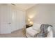 Inviting bedroom with a closet, chair, and soft carpet at 2410 Prospect St, Sarasota, FL 34239