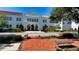 A large white school building is shown from across the street at 2410 Prospect St, Sarasota, FL 34239