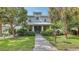 Charming home featuring a walkway, lush landscaping, neutral paint and a welcoming entryway at 2410 Prospect St, Sarasota, FL 34239