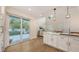 Bright open kitchen features a large center island, stainless appliances, and seamless access to the outdoor patio at 2410 Prospect St, Sarasota, FL 34239