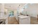 Bright open kitchen features a large center island, stainless appliances, and seamless access to the outdoor patio at 2410 Prospect St, Sarasota, FL 34239