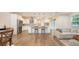 Bright, modern kitchen with stainless appliances, center island, and open floor plan to living room at 2410 Prospect St, Sarasota, FL 34239