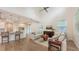 Open-concept living room with modern furnishings and an adjacent kitchen at 2410 Prospect St, Sarasota, FL 34239