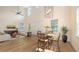 Open-concept living room with modern furnishings and an adjacent dining area at 2410 Prospect St, Sarasota, FL 34239