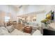 Open-concept living room with modern furnishings and an adjacent kitchen at 2410 Prospect St, Sarasota, FL 34239