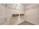 Organized walk-in closet featuring wire shelving, baskets, and ample storage space at 2410 Prospect St, Sarasota, FL 34239