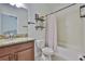 Cozy bathroom featuring granite countertop, shower/tub and toilet at 2450 Dovesong Trace Dr, Ruskin, FL 33570