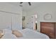 Bedroom featuring large closet, dresser, and door to bathroom at 2450 Dovesong Trace Dr, Ruskin, FL 33570