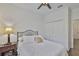 Bright bedroom featuring a bed, lamp, and closet at 2450 Dovesong Trace Dr, Ruskin, FL 33570