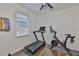 Home gym with peloton and treadmill and natural light at 2450 Dovesong Trace Dr, Ruskin, FL 33570