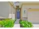 Charming home featuring a stone accent wall and a beautiful, colorful front door entrance at 2450 Dovesong Trace Dr, Ruskin, FL 33570
