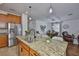 Gourmet kitchen featuring granite countertops, stainless steel appliances, and a breakfast bar at 2450 Dovesong Trace Dr, Ruskin, FL 33570